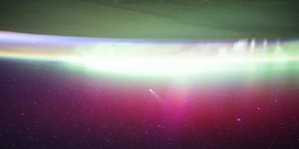 Astronauts aboard the ISS Capture Stunning Images of Two Comets Above Northern Lights
