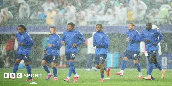 France and Iraq Navigate Extended Weather Delay in World Cup Clash